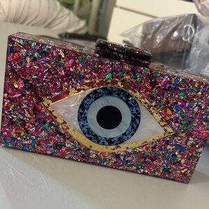 Compact Evil Eye Bag – Fits Cellphone
 $20